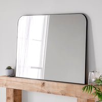 Minimal framed black overmantle, perfect contemporary mirror.&nbsp; Great in an industrial setting or set over a contemporary mantlepiece. The slim frame allows the mirror to reflect the whole space reflecting light into the space.