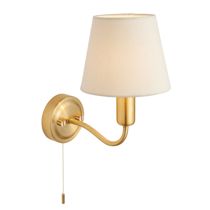 This stylish brass wall light with ivory shade has a IP44 rate. It is suitable for bathrooms and has a pull cord. It creates an instant classy and elegant feel.   H: 24 cm W: 15 cm D: 24 cm.