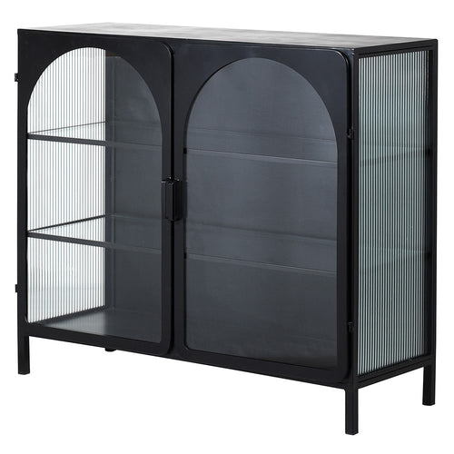 Black metal cabinet with arched doors and ribbed glass adding to the industrial feel of this really useful piece of furniture.
