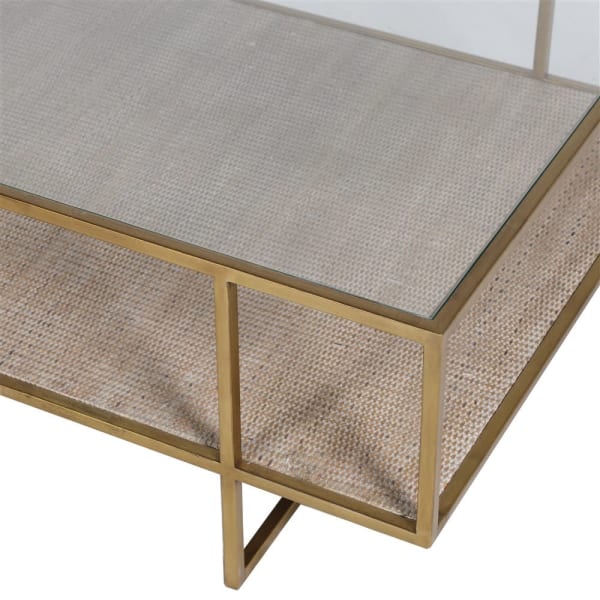 A good size large coffee table finished in a brushed gold iron legs with a glass top and useful shelf space.  