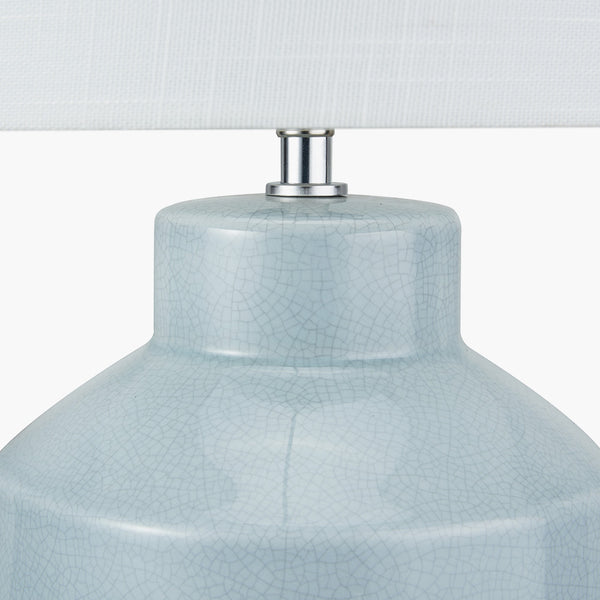 Minimalist ceramic table lamp. Exquisite crackle effect detail on this beautifully duck egg blue coloured lampbase and the white linen shade will add a 'scandi' factor to any interior.