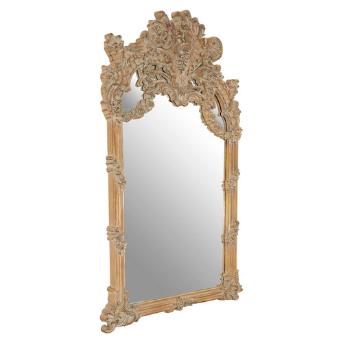 An oversized ornate mirror in a weathered, limewashed finish.