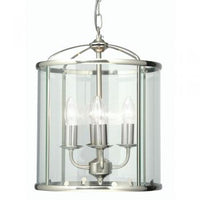 This elegant pendant light features a classic lantern design in antique chrome with four interior candle-style lights. The clear glass panels and polished metal frame create a timeless aesthetic that works beautifully in entryways, hallways, kitchens, and dining areas.