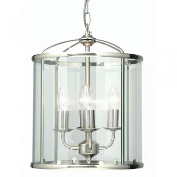 This elegant pendant light features a classic lantern design in antique chrome with four interior candle-style lights. The clear glass panels and polished metal frame create a timeless aesthetic that works beautifully in entryways, hallways, kitchens, and dining areas.