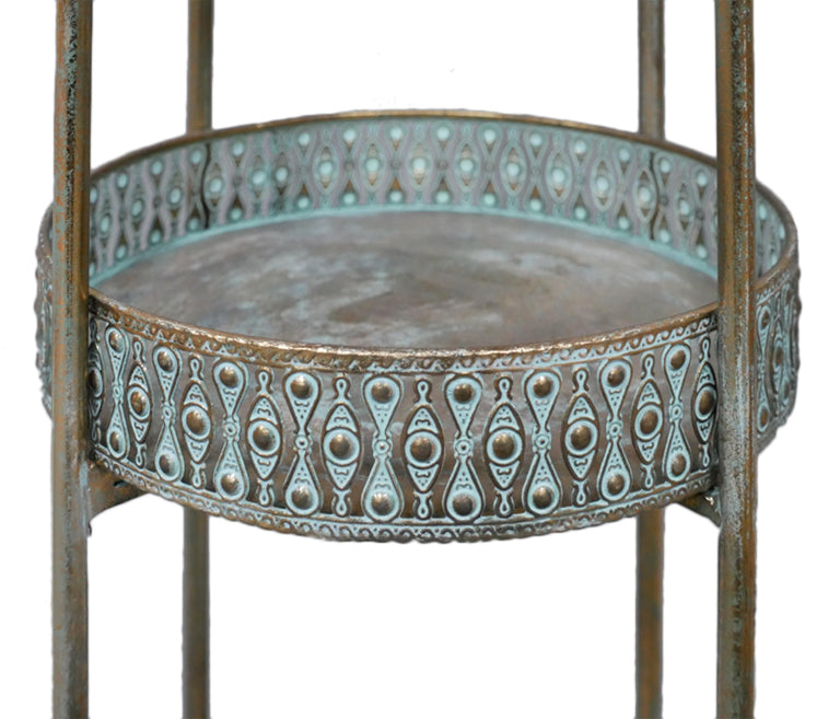A unique and very pretty shelf unit with pierced metal detailing around shelves that can be lifted out and also used as trays. Finished in a rustic antique gold, this furniture piece has Moroccan vibes with five shelves encased in an outer frame that can fold flat.