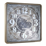Moving cog clock in antiqued mirrored finish with square gilt metal frame.