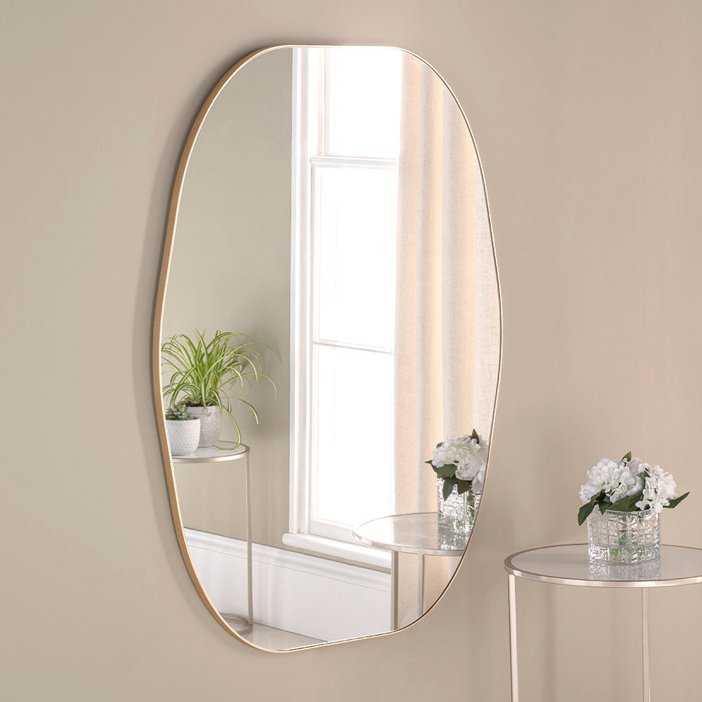 Organic, uneven framed gilt mirror of a smaller size. Perfect Bathroom or Bedroom mirror.&nbsp; The organic nature of the uneven, minimal frame adds a unique style to any room.