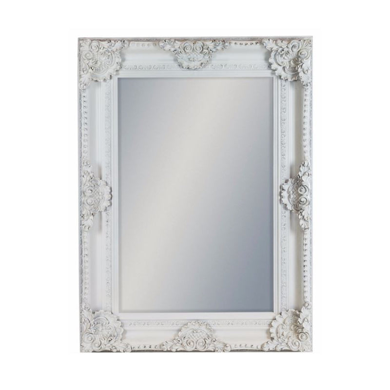 An ornate white baroque framed mirror with intricate carvings and a mirrored glass surface.