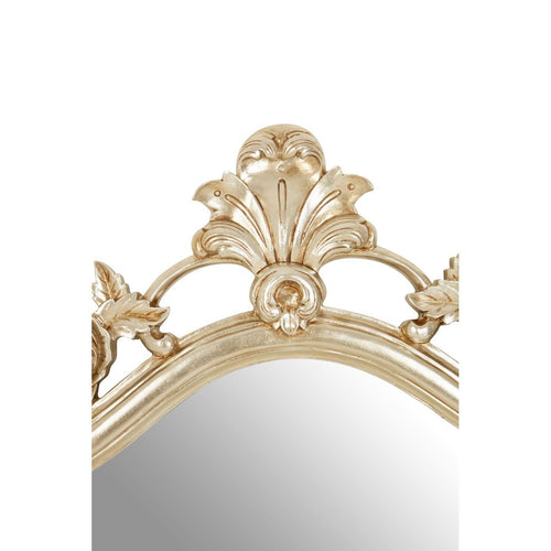 Ornate classic mirror in a champagne colour , classically decorated with flowers.  Beautiful curved shape.