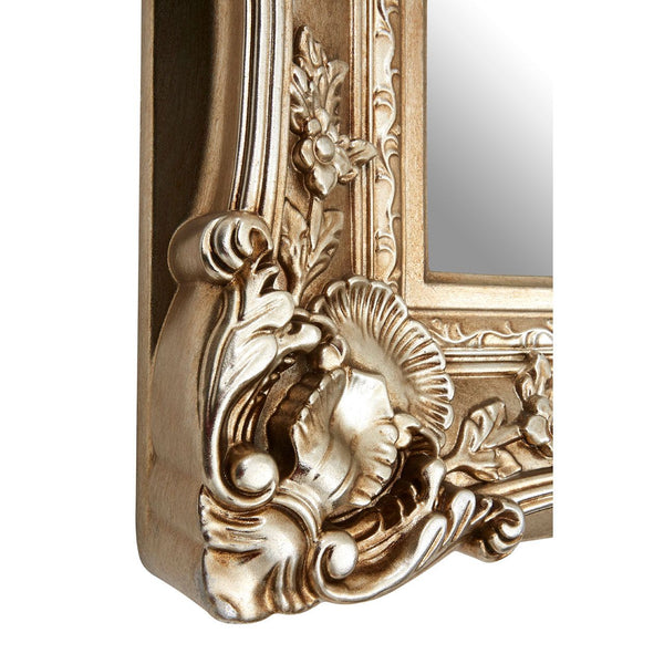 Compact but impactful soft silver heavily baroque framed mirror.  Huge impact from a smaller mirror.