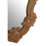 Brown, wooden rococco framed sheild shaped ornate mirror.
