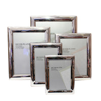 Add a touch of sophistication to your memories with our Silver Plated Photo Frames. Expertly crafted and tarnish-resistant, these frames offer a mirror-like finish that complements both modern and classic interiors. Available in multiple sizes — 3.5" x 5", 4" x 6", 5" x 7", 6" x 8", and 8" x 10" — each frame provides a sleek, polished border that enhances your photographs without overpowering them.