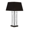 A Stylist Stainless Steel Table Lamp With a Black Granite Base complemented with a black shade.