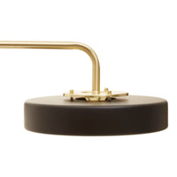 Stunning brushed gold floor lamp with disc shaped top.