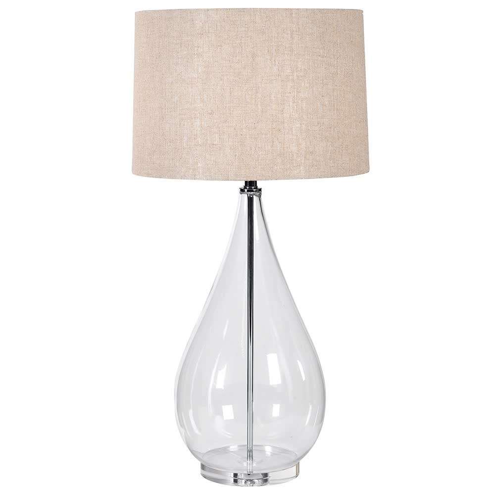 Exceptionally tall simple glass table lamp with a neutral linen style shade, the height of this lamp makes a real statement and will add a lot of light to any area.  H:  90 cm W:  45 cm.