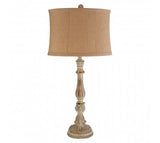 Extra tall wooden table lamp with oval linen shade.