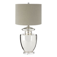 Tall, classic, glass urn shaped table lamp with a round neutral lampshade, a really clean, contemporary feel.