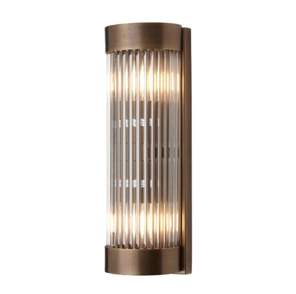 Wall light in antique brass finish with glass rods, clean simple finish.