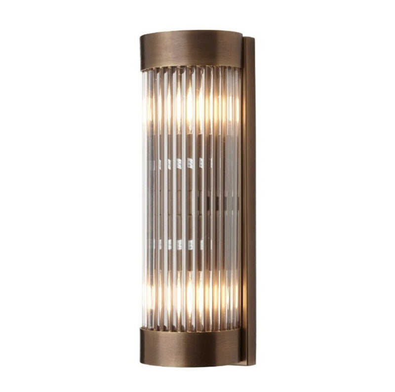 Wall light in antique brass finish with glass rods, clean simple finish.