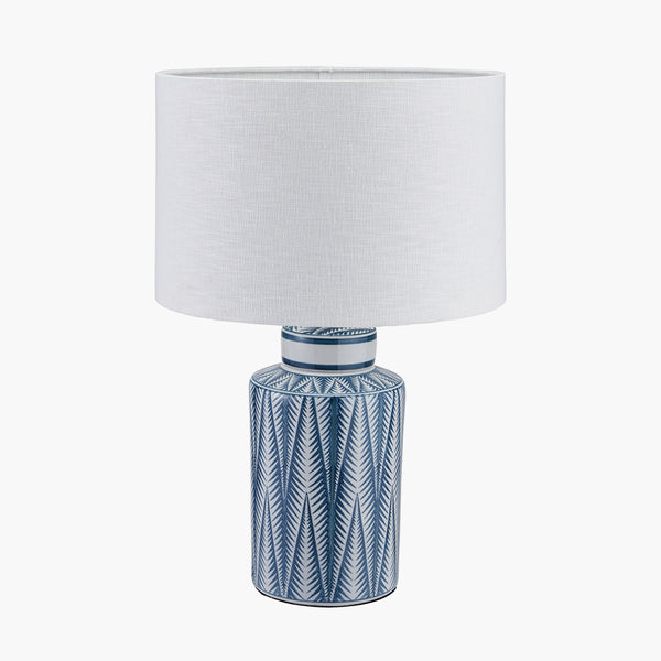  A beautiful white and blue ceramic table lamp with a "tribal" pattern. It will look amazing with a white, grey or blue shade.