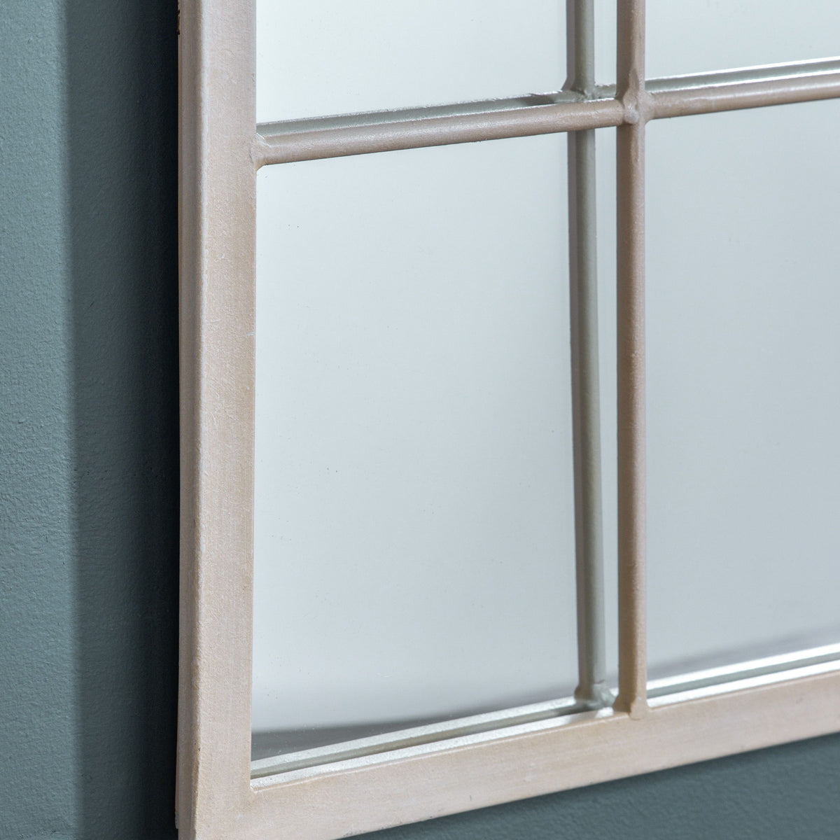 Divided mirror panes on cream arched window mirror