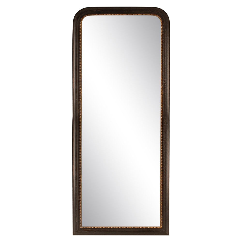 Black and gold standing mirror, a cheval type mirror that can also be a leaner, on a neutral background