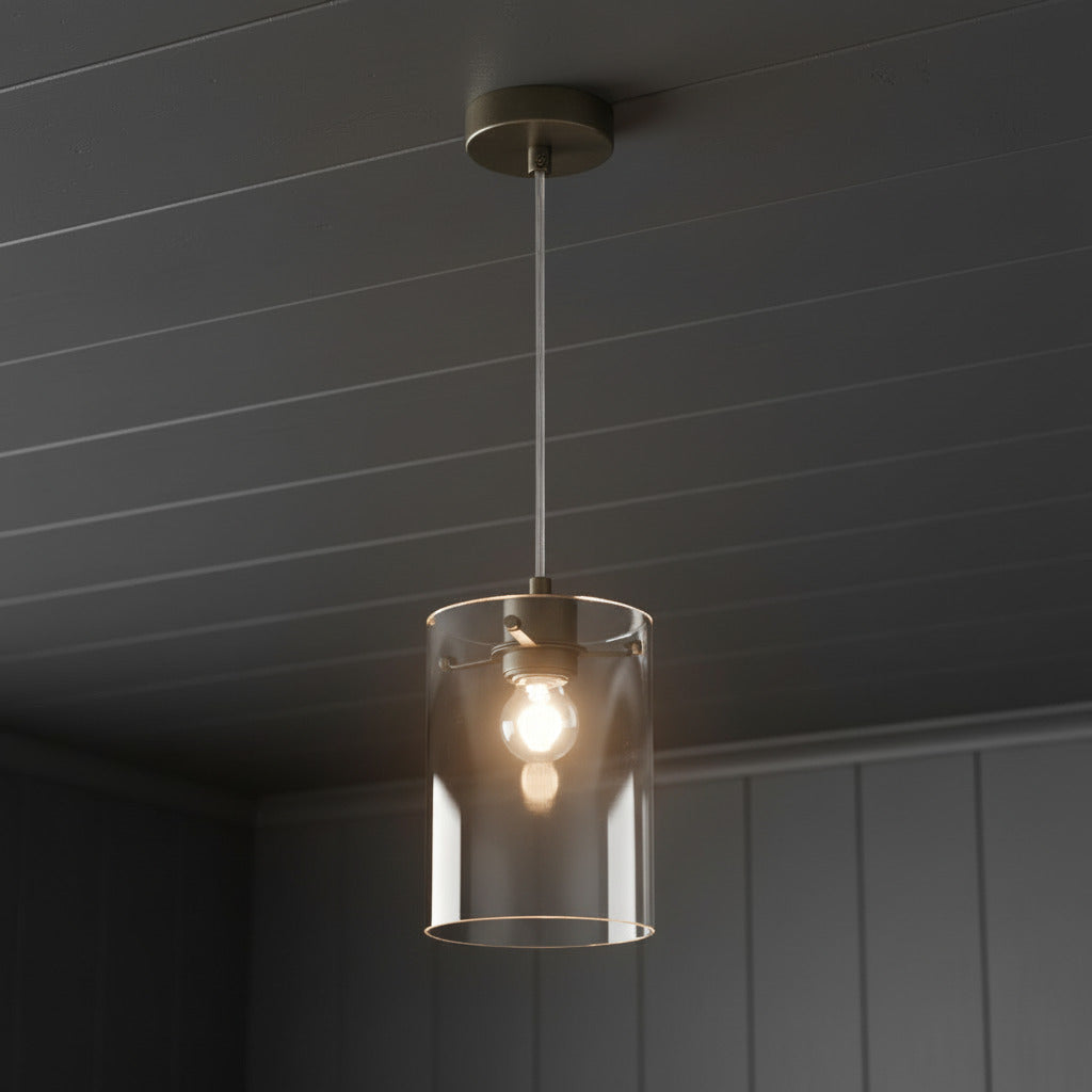 A stunning glass pendant light blending modern elegance with timeless design that will transform your space into a warm inviting haven. &nbsp;

Featuring a clear cylindrical glass shade that allows the warm glow of an Edison-style bulb to shine through, this pendant is ideal for creating a cozy and inviting atmosphere in any room. &nbsp;

The sleek, minimalist design of this pendant means it works in a variety of spaces.&nbsp; Combine them and hang above a kitchen island or dining table to create a well lit