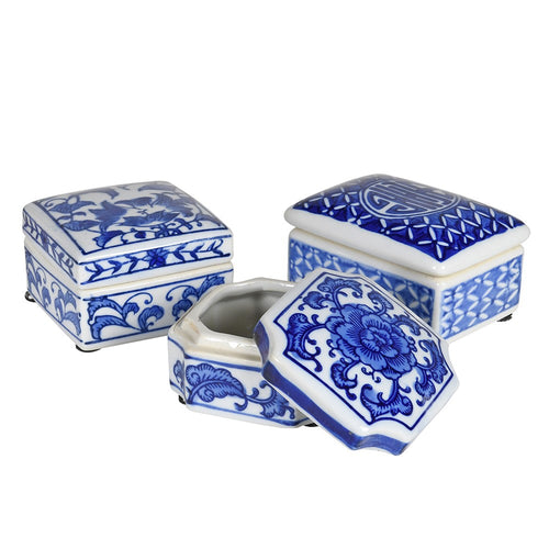 Set  of 3 differently shaped blue and white ceramic boxes the largest of which is 10 cm in width.  Great Xmas present for the lover of Vintage items.
