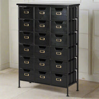 Black wood and metal industrial style 18 drawer chest. Exceptionally useful chest of drawers, perfect for the urban office. Set against a pale paneled wall on a marble floor.