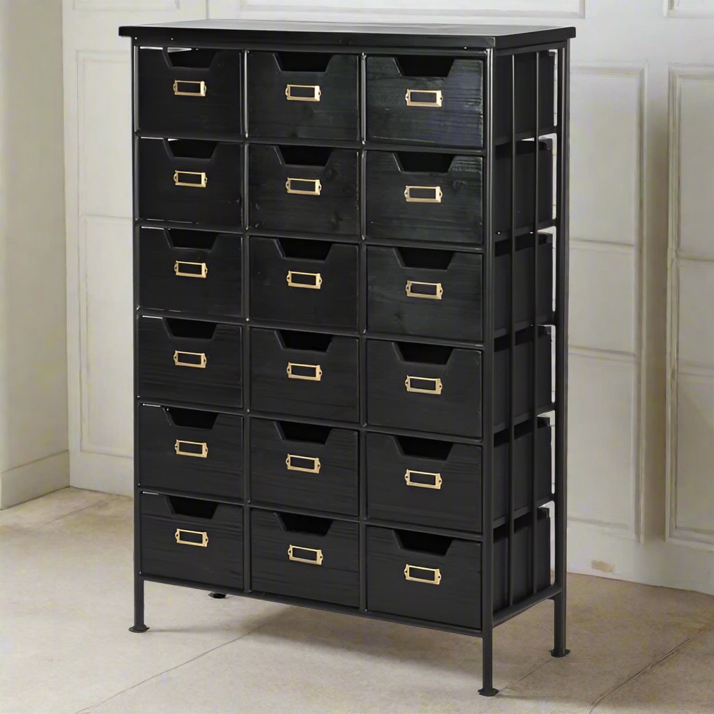 Black wood and metal industrial style 18 drawer chest. Exceptionally useful chest of drawers, perfect for the urban office. Set against a pale paneled wall on a marble floor.