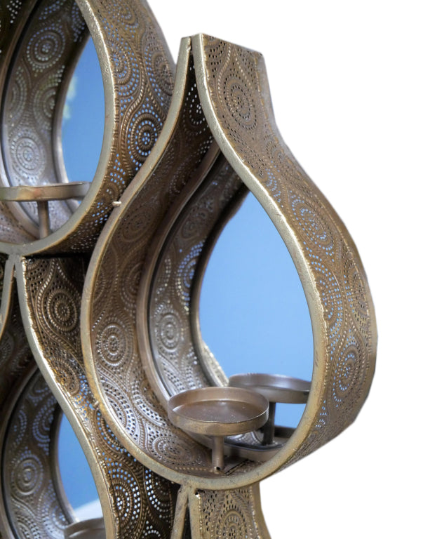 Tall teardrop-shaped mirror with pierced Moroccan-style metal frame and candleholders