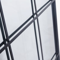 Exceptionally tall window mirror, black metal with 12 panes.  Suitable for indoor or outdoor use. Close up detail of mirror against a white background.