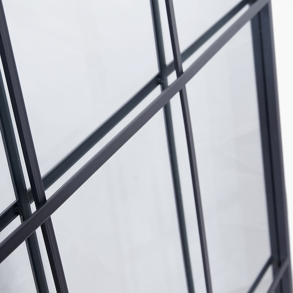 Exceptionally tall window mirror, black metal with 12 panes.  Suitable for indoor or outdoor use. Close up detail of mirror against a white background.