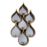 Tall teardrop-shaped mirror with pierced Moroccan-style metal frame and candleholders